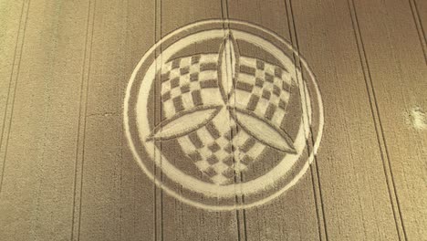 aerial view descending over windy south wonston 2023 propeller chequered crop circle blowing golden hampshire wheat field