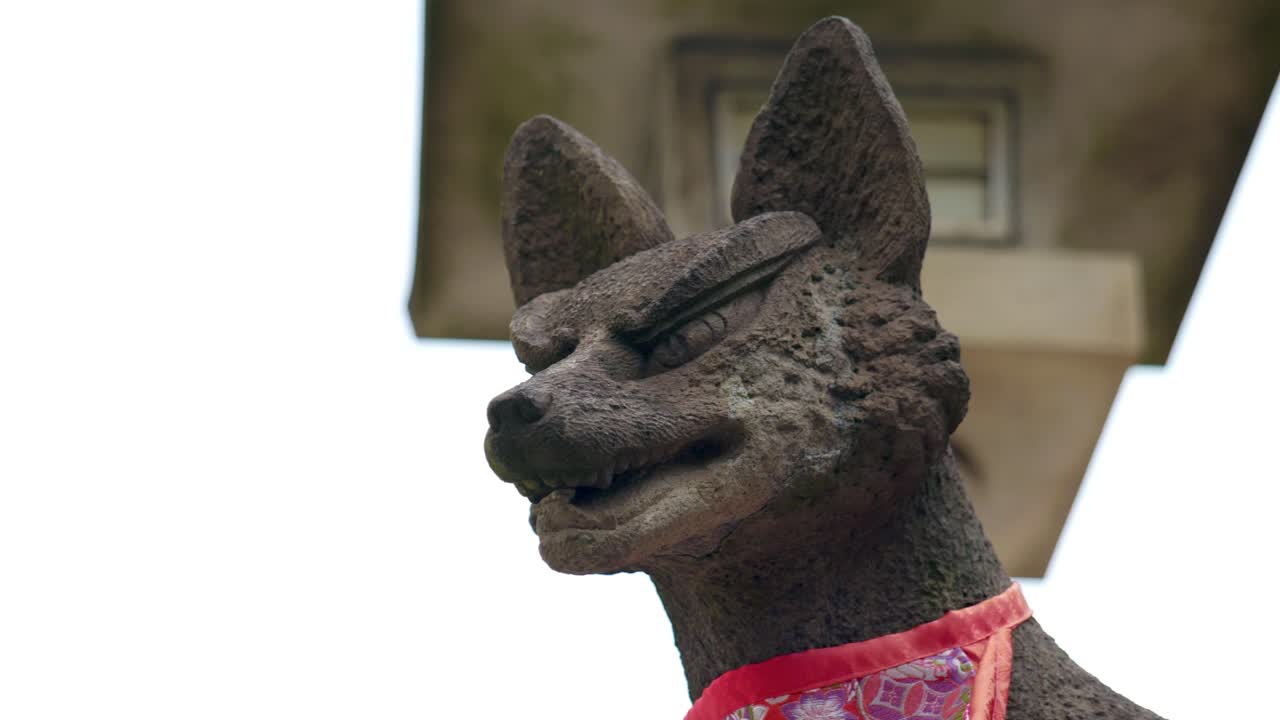 A Statue of a Fox in a Traditional Inari Shrine Japanese Temple in Tokyo, Japan