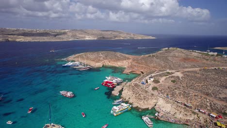 wide establishing aerial of the blue lagoon, stunning clear mediterranean island of malta