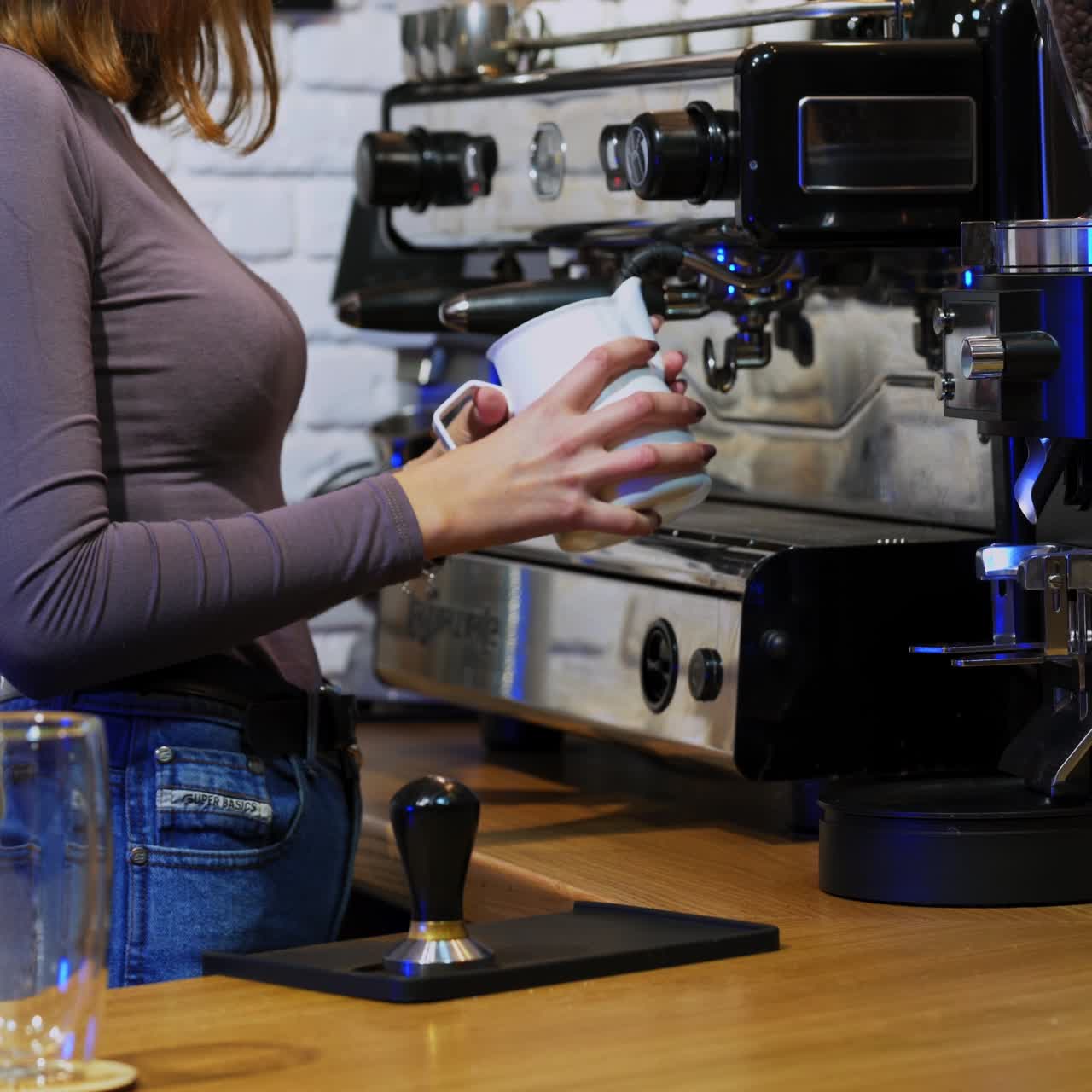 Professional barista preparing coffee