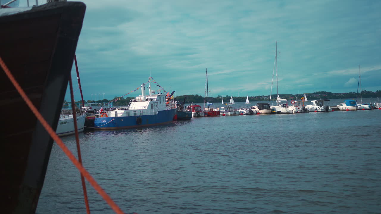 Side view of yachts moored in the beautiful small marina pier