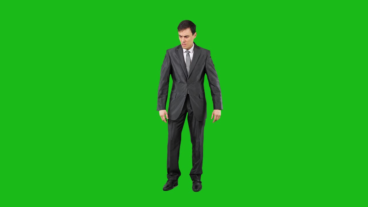 Man in Suit Gestures and Shows Disapproval on Green Screen