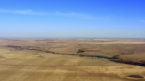 aerial view of rural landscape with a river and village