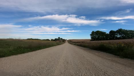 Point-of-view-footage-while-driving-down-a-gravel-road-in-rural-Iowa