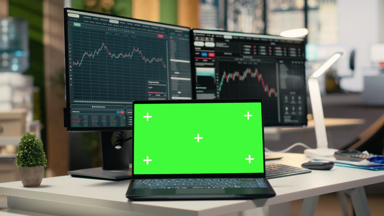 Close up of trading software in forex office with graphs on green screen laptop