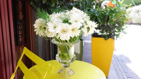 white gerbera daisies in a glass vase