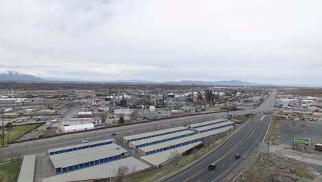 Rising-aerial-view-over-storage-lockers-and-an-oil-processing-facility-in-Salt-Lake-City,-Utah