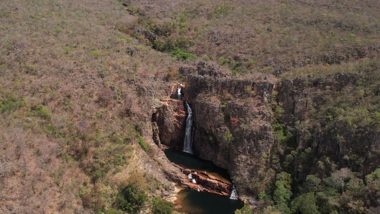 aerial view of the Catedral waterfall and Macaco river in Complexo do Macaco in Chapada dos Veadeiros Goi&aacute;s Brazil sunny day, waterfall, rocks