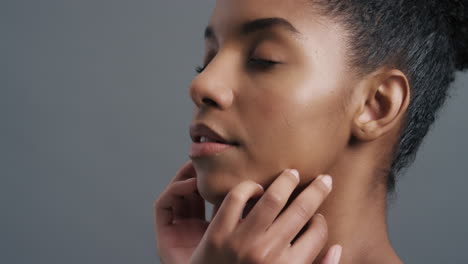 close-up-portrait-beautiful-african-american-woman-gently-touching-face-with-hands-enjoying-smooth-healthy-skin-complexion-natural-feminine-beauty-skincare-concept