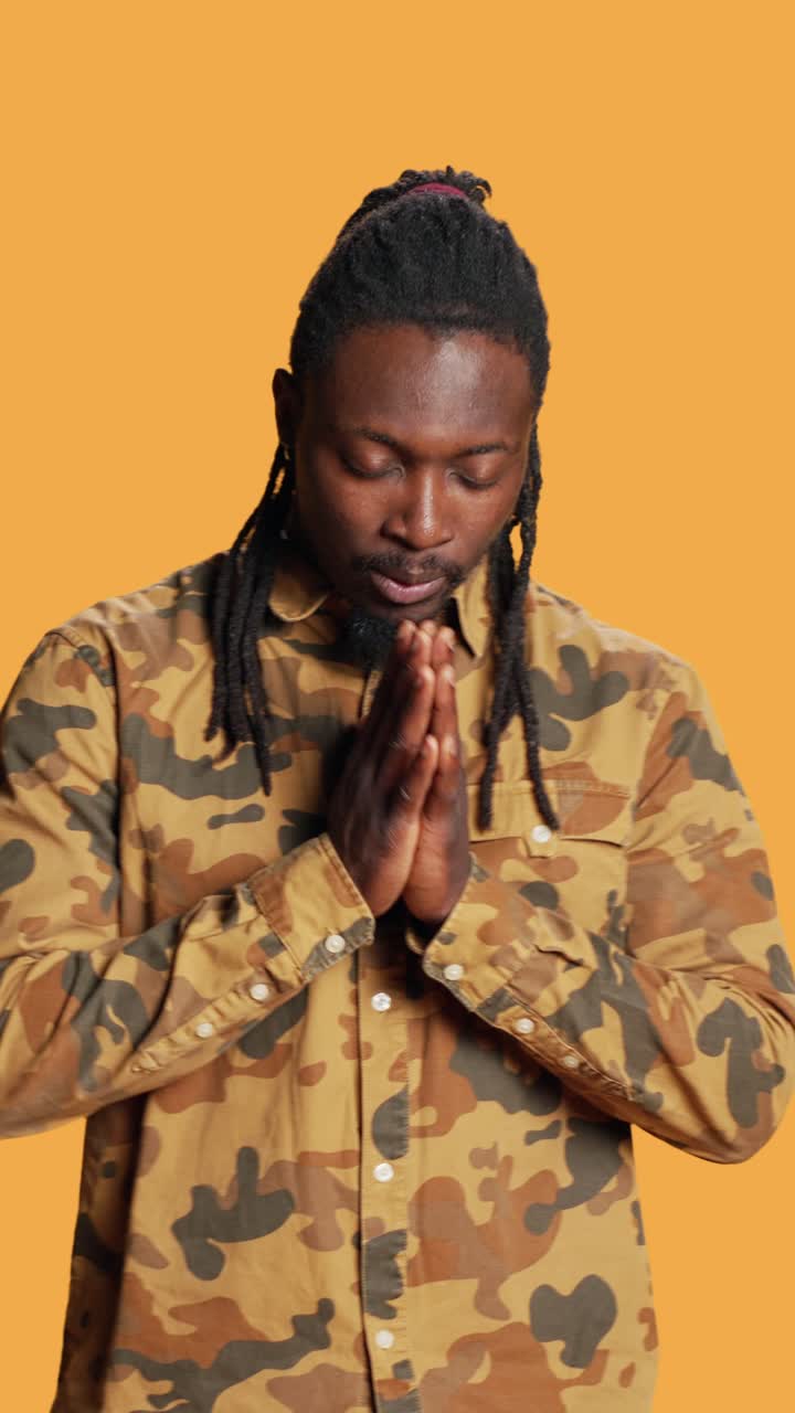 Vertical Video African american person praying to Jesus in studio