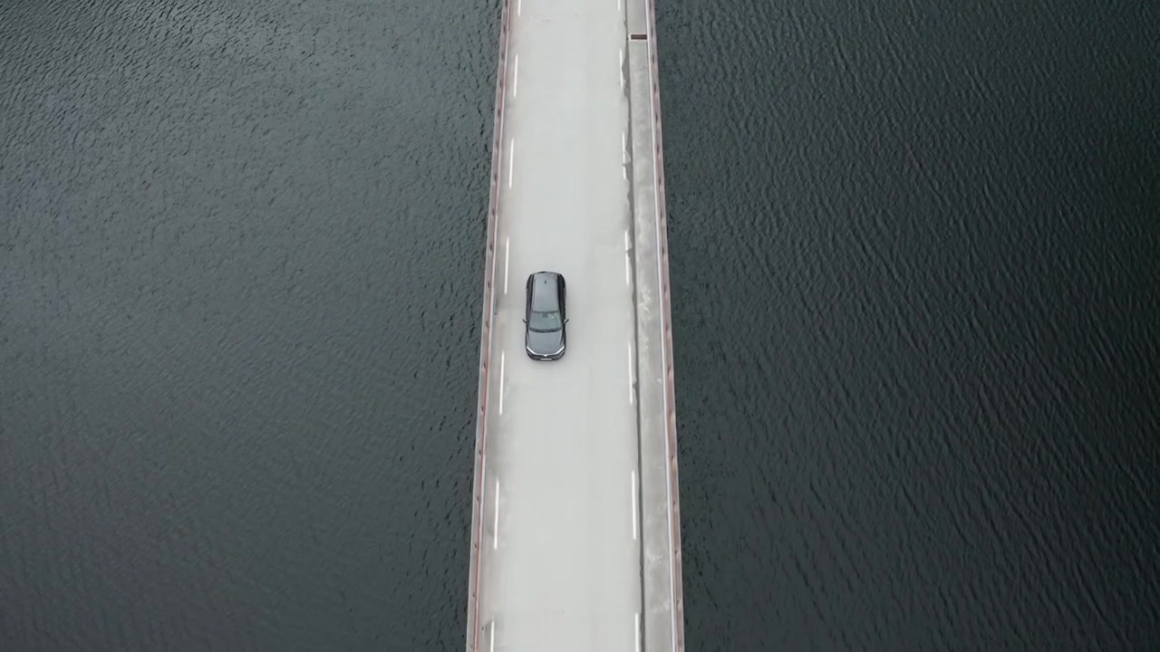 Hyunday Kona electric 2020 driving over bridge, birds eye view
