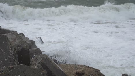 waves crashing rocks on the west coast of denmark