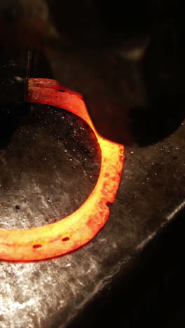 blacksmith working on a horseshoe