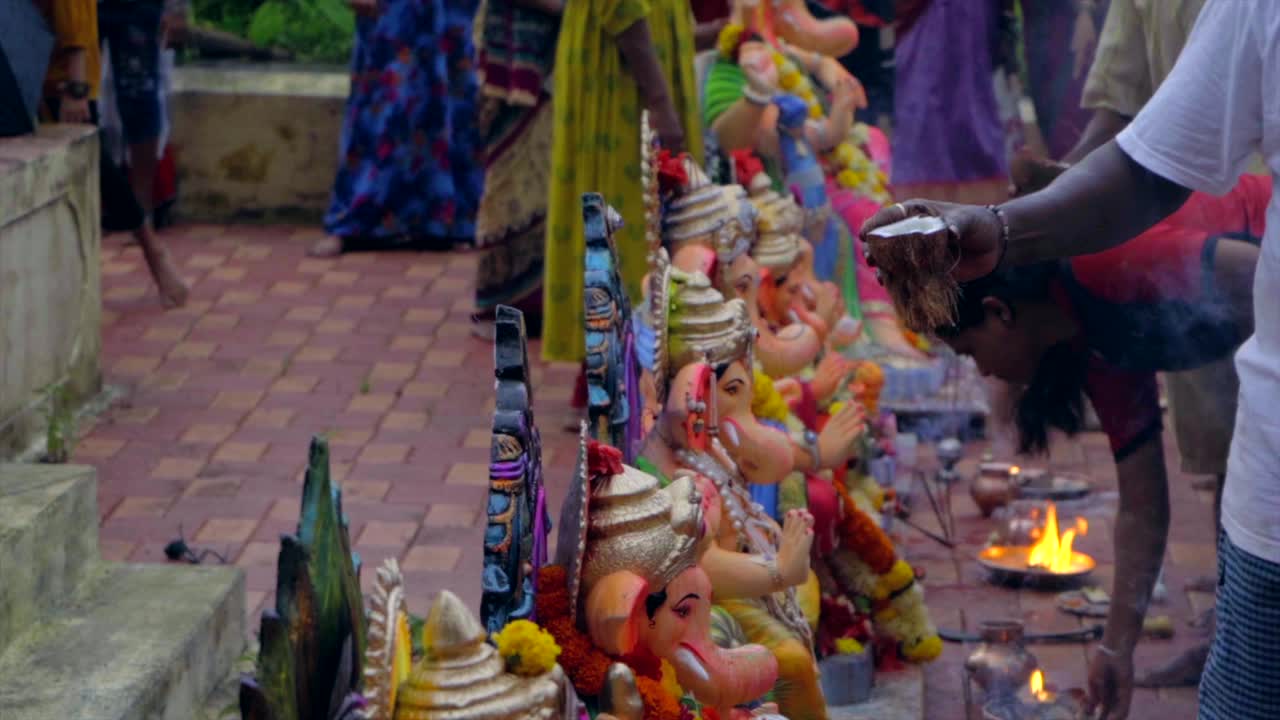 coconut water on ganpati statue ganesh visarjan