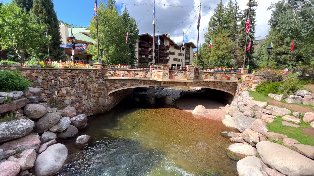 Scenic Stone Bridge over a Crystal Clear River in a Mountain Resort