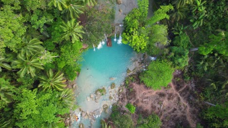 4k drone video flying directly down towards cambugahay falls in siquijor island in the philippines