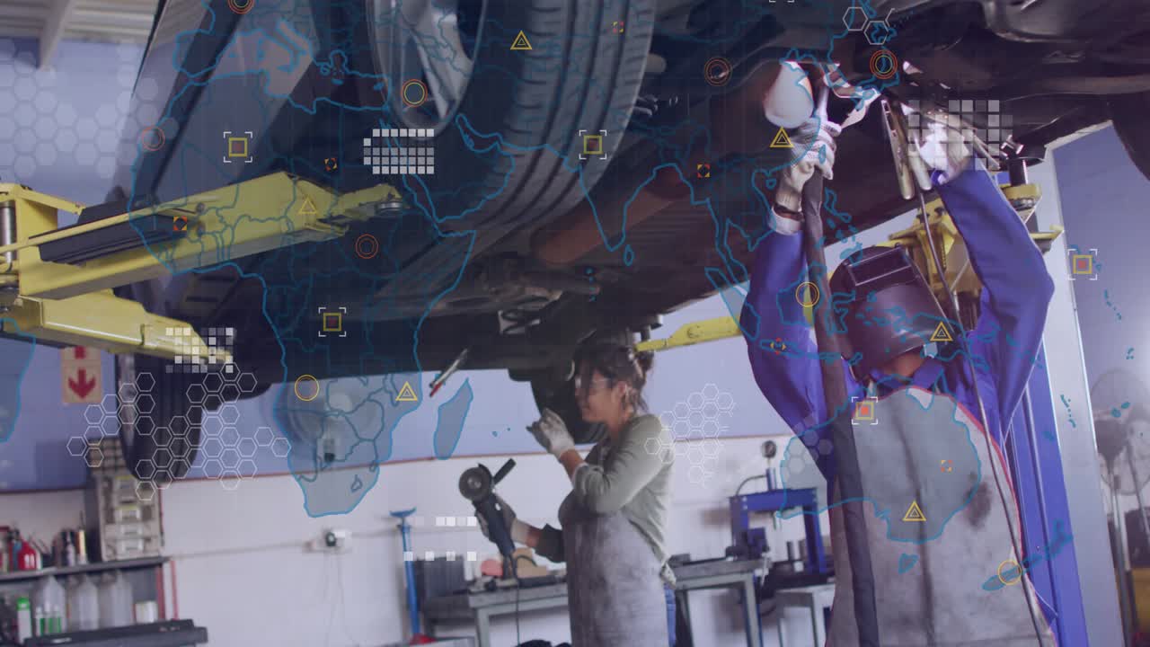 Auto tech duo welding torch sparking activating data overlay, coworker inspecting part for quality