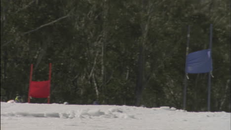 A-skier-skis-down-a-mountain-around-colored-flags