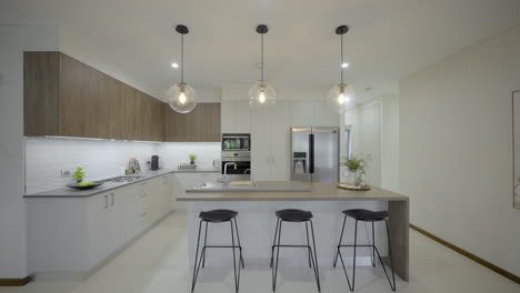 Contemporary open plan kitchen, island bench and breakfast area