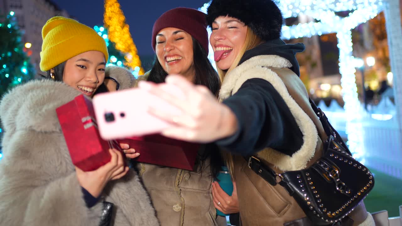 Friends celebrating the holidays and taking selfies