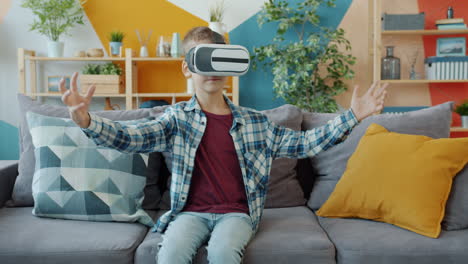 boy experiencing virtual reality on a sofa