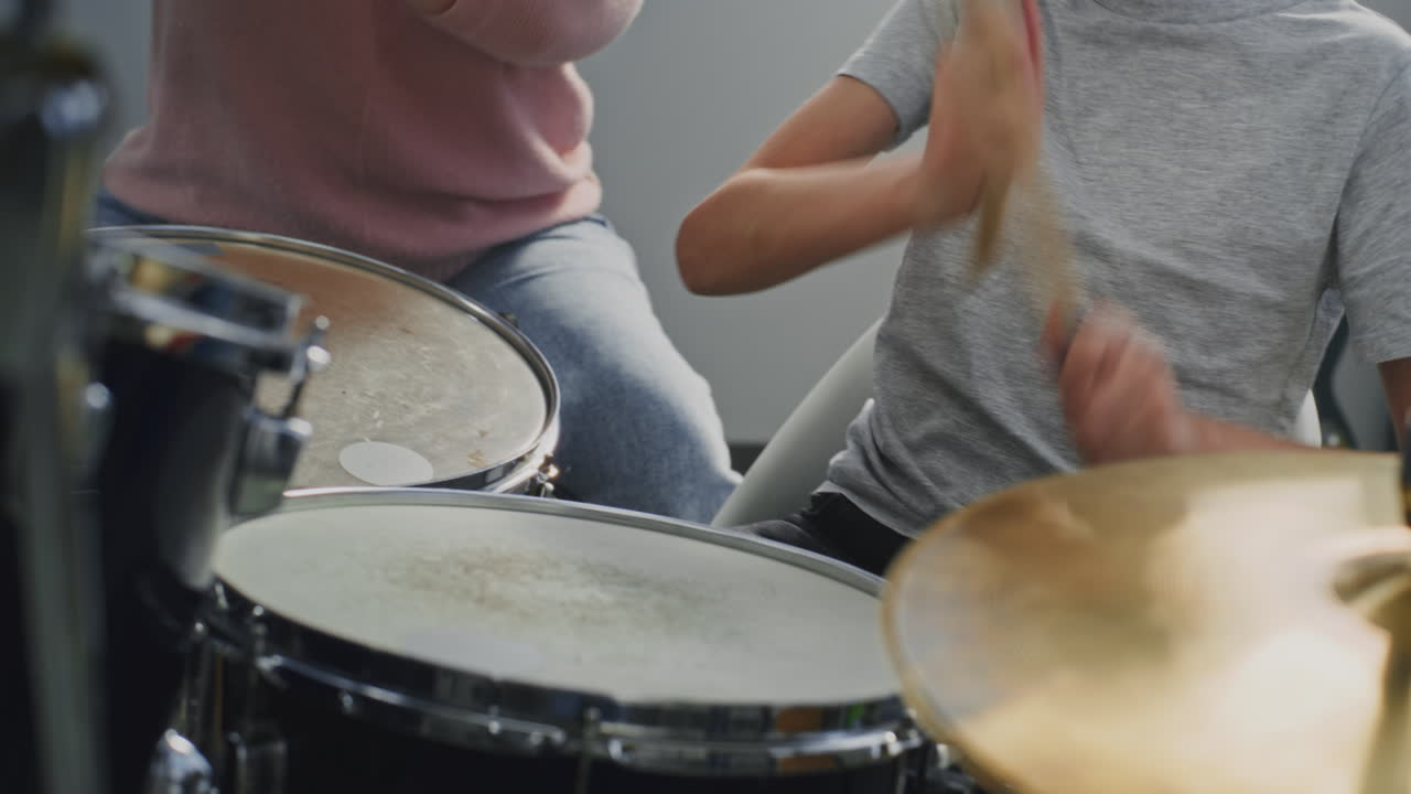 People playing drum set