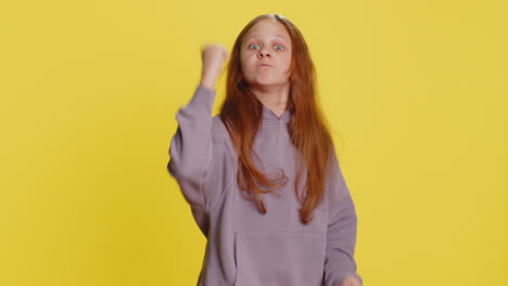 aggressive angry child girl trying to fight at camera shaking fist boxing punishment threaten
