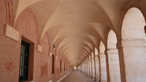 Tilt-down-shot-of-the-arches-in-the-San-Antonio-square,-Aranjuez,-Spain