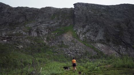 person trekking with a dog pet in salberget, norway