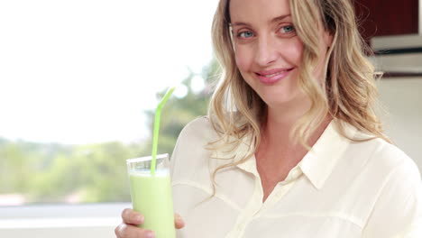 pregnant woman drinking smoothie