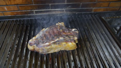 cooking a juicy grilled ribeye