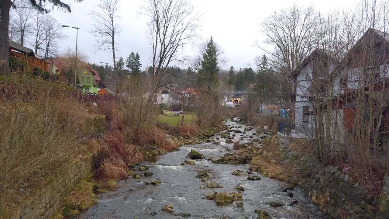 Kamienna River flowing through the Szklarska Poreba town in autumn, Lower Silesia, south-western Poland