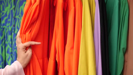 a woman shopping for clothes in a store