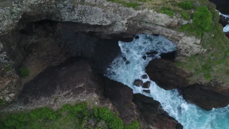 Revealing aerial shot of sea caves in Crescent Head National Park