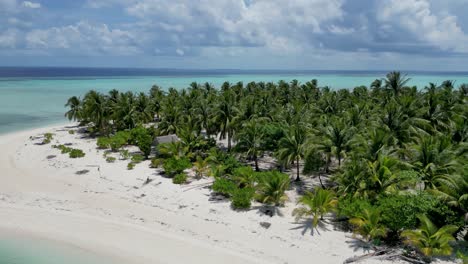 aerial parallax reveals palm trees and bungalows on onok island, balabac