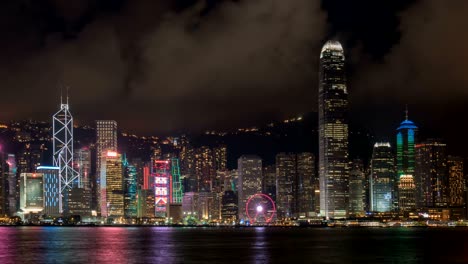 buildings city lights by victoria harbour, hong kong at night, time lapse