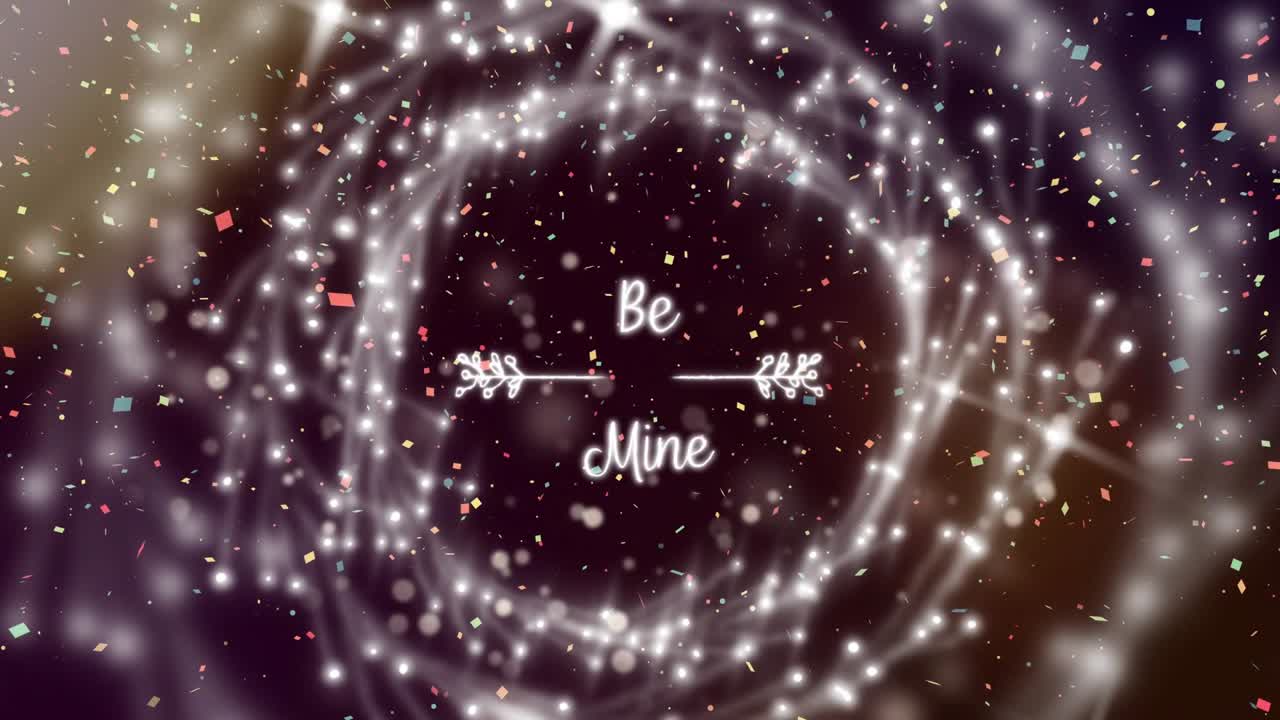 Animated particles emerging forming ring revealing Be Mine, confetti drifting for romantic reveal