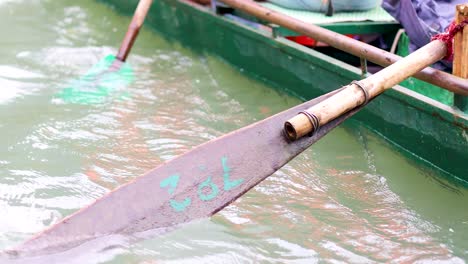 paddles moving through water in vietnam