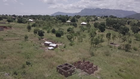 aerial: new home construction in rural malawi hilltop in east africa