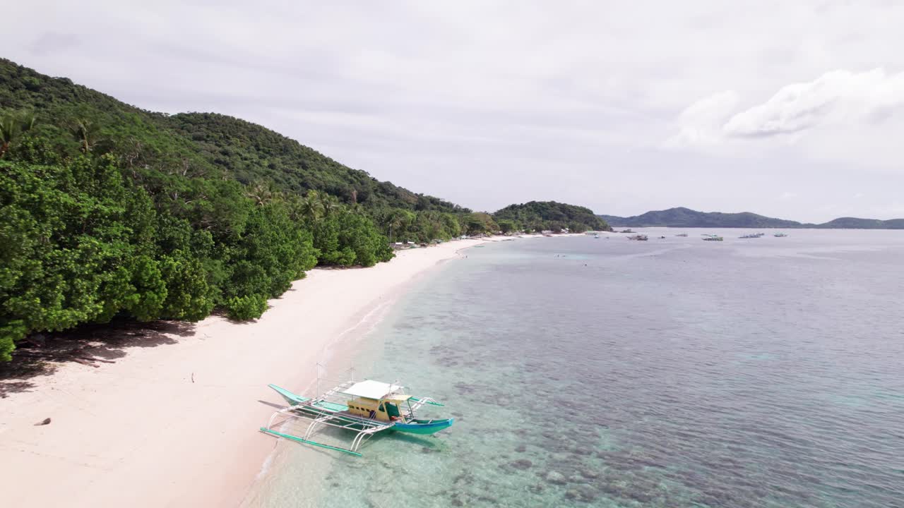 Aerial View of Iloc Island, Philippines, White Sand and Boat at the Beach, Green Landscape and Turquoise Sea