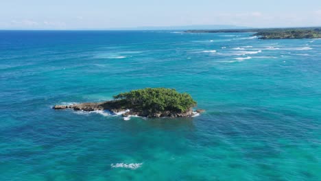 aerial perspective of big rock in turquoise waters of arroyo salado beach