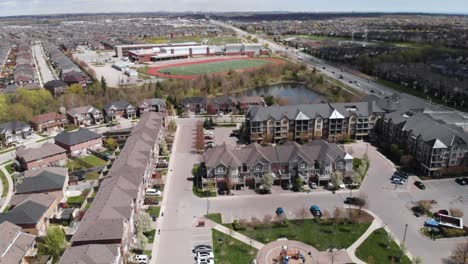 drone flying towards a school in summer in burlington