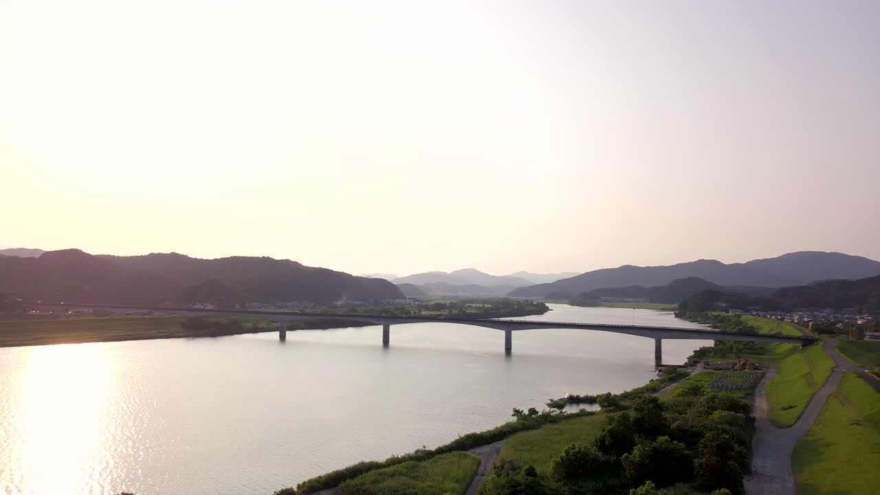 Drone aerial view of Shikoku, Nakamura during Sunset with soft light. Countryside of Japan, New Shimanto River Bridge..