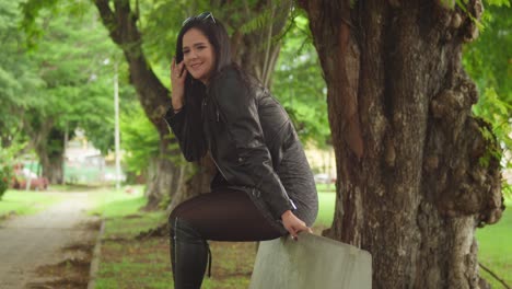 a woman in boots and a jacket spends a lovely day at a tropical park in the caribbean