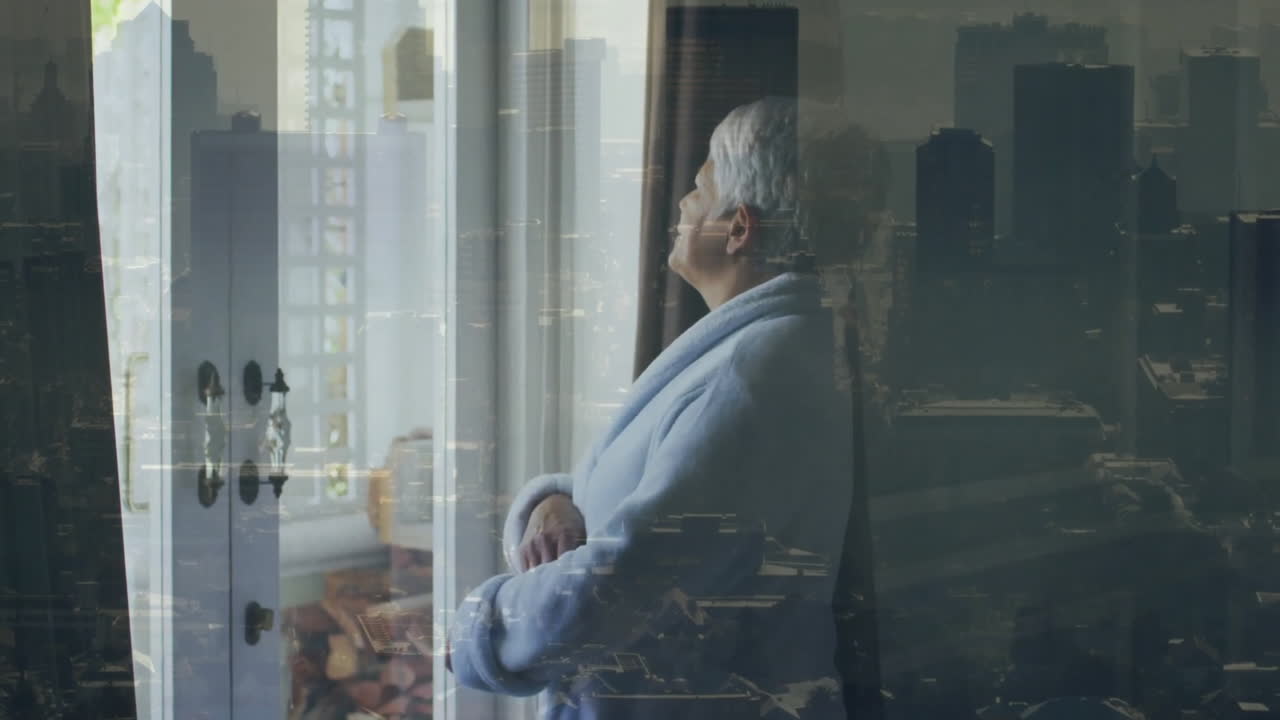 Animation of senior biracial woman looking through window over cityscape