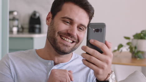 happy young man having video chat using smartphone waving at baby smiling father enjoying chatting on mobile phone at home