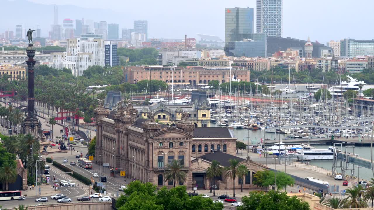 Aerial drone view of the Port Vell, the Columbus Monument and the Junta d'Obres del Port building in Barcelona, Spain