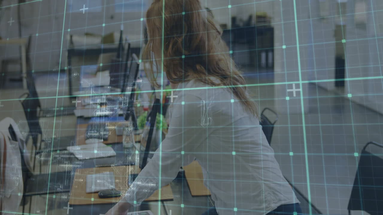 Businesswoman on phone in office with digital data grid overlay animation