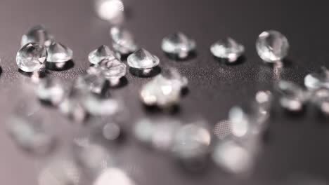 many diamonds lying on black background 4k movie