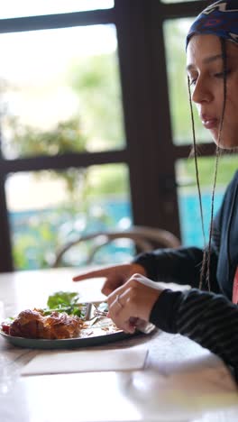 woman eating breakfast in a restaurant